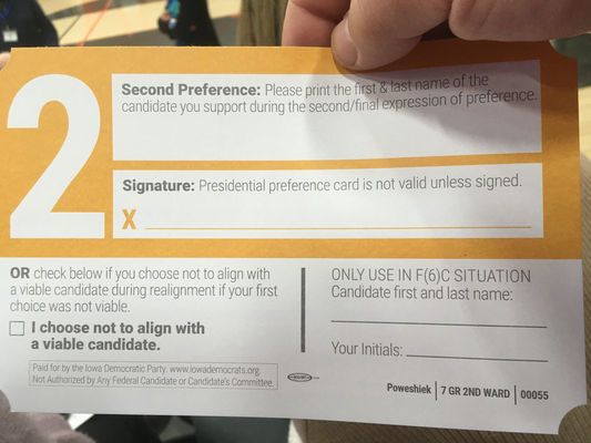 A card.  A big '2' is in the upper-left-hand corner.  The first area reads 'Second Preference: Please print the first & last name of the candidate you support during the second/final expression of preference.'  Below that is an area labeled 'Signature: Presidential preference card is not valid unless signed.'  Once again, there's an 'X' next to the signature area.  Below that 'OR check below if you choose not to align with a viable candidate during realignment if your first choice was not viable.'  Then a check box next to 'I choose not to align with a viable candidate.'  Below that, a box that says 'Paid for by the Iowa Democratic Party www.iowademocrats.org.  Not Authorized by Any Federal Candidate or Candidates' Committee'.  In a column to the right, 'ONLY USE IN F(6)C SITUATION Candidate first and last name:', a space to fill in, 'Your Initials:', and a space for the initials.  In small letters at the bottom, 'Poweshiek | 7 GR 2ND WARD | 00055'