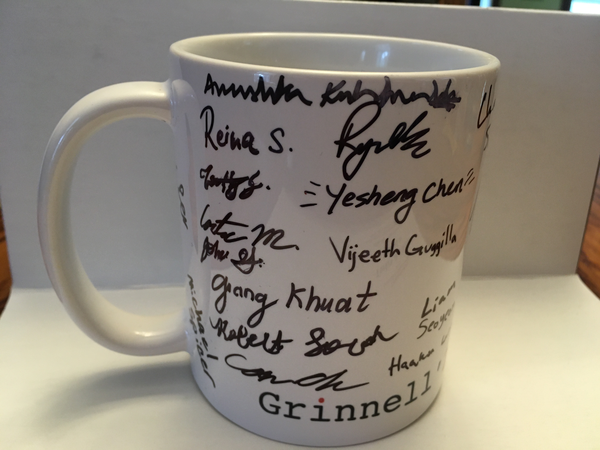The same mug, from a different perspective.  More signatures are visible.
