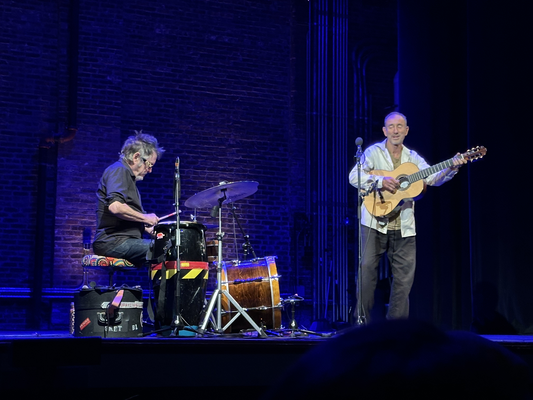 Jonathan Richman and Tommy Larkins on stage.